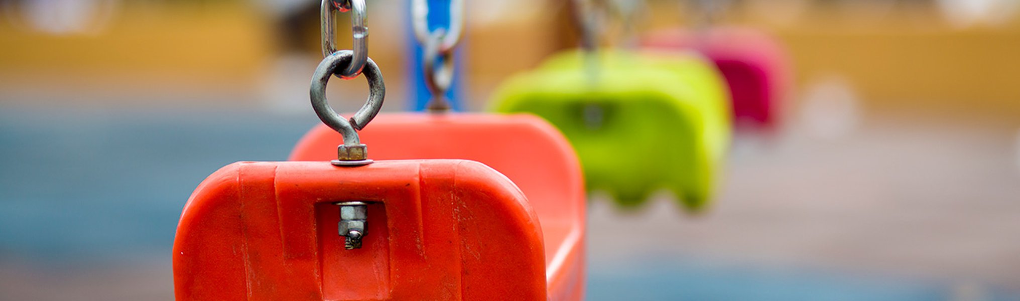 Close up of empty swing in a playground